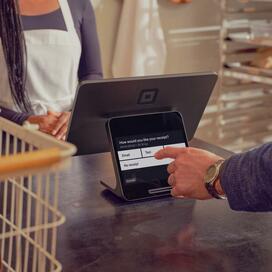 Take countertop payments with the dual-screen Square Register