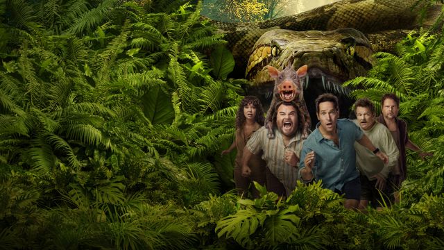 alt="Anaconda film poster with a group of people including Paul Rudd and Jack Black standing looking scared in a dense jungle as a massive snake looms behind them"