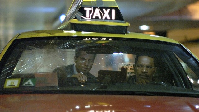 alt="Collateral movie still of Tom Cruise in a taxi"