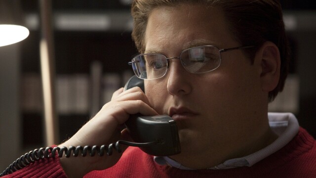 alt="Moneyball image still with Jonah Hill on the phone"