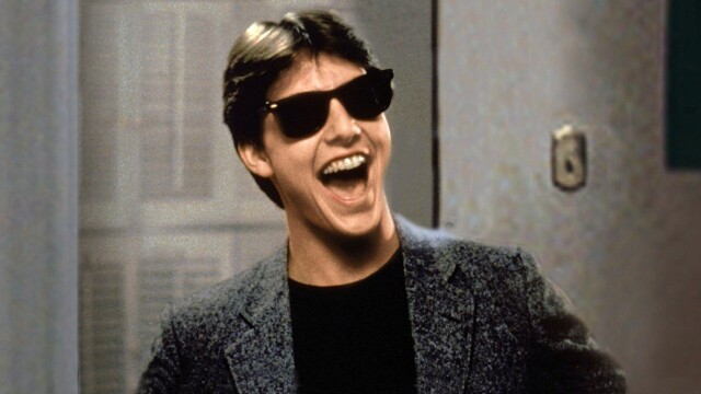 alt="Risky Business movie image of Tom Cruise in sunglasses smiling"