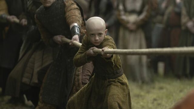 alt="Dexter Sol Ansell as young Prince Aegon Targaryen “Egg,” competing in tug-of-war in HBO’s A Knight of the Seven Kingdoms."